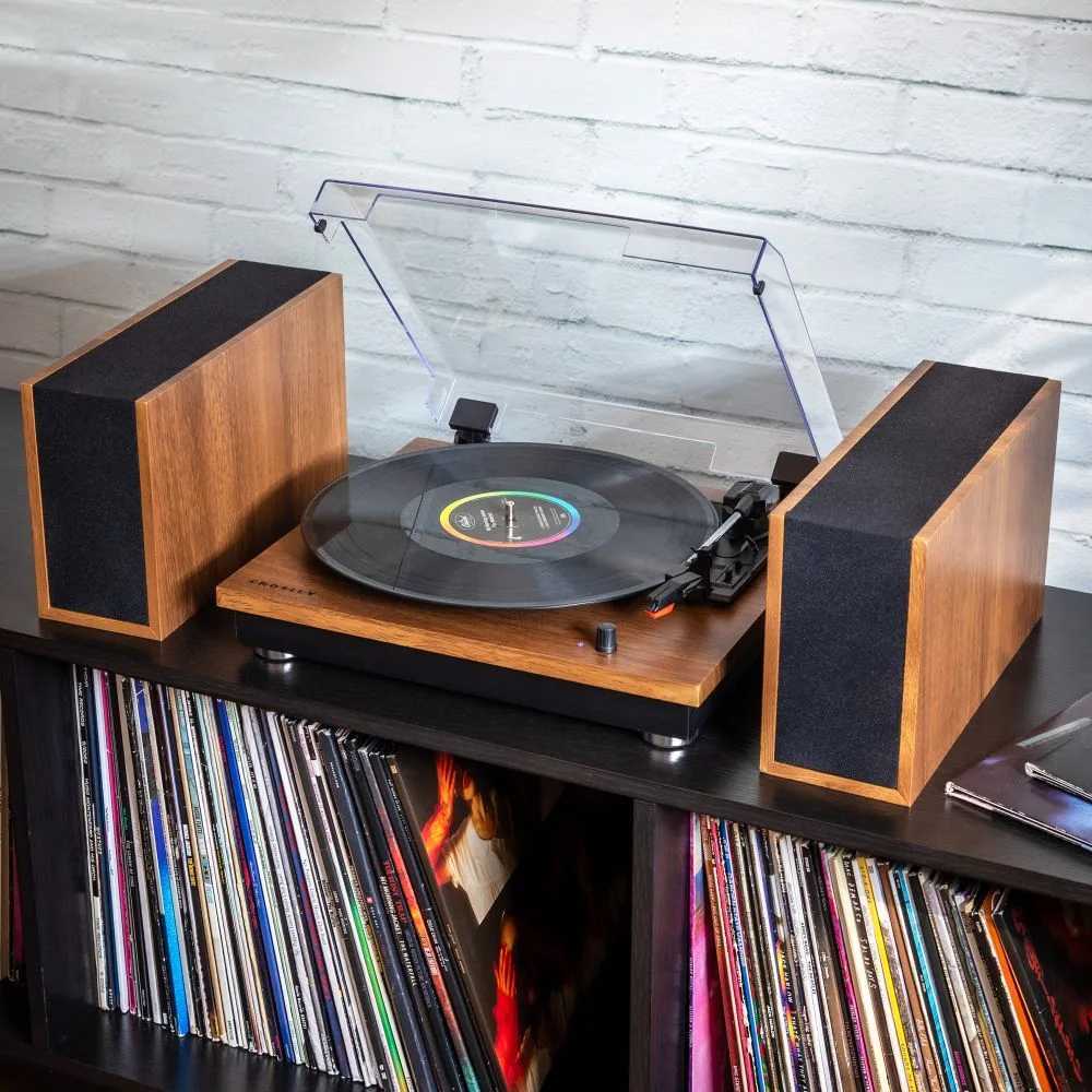 Crosley Riff Record Player With Speakers - Walnut is set up with its detachable speakers on either side