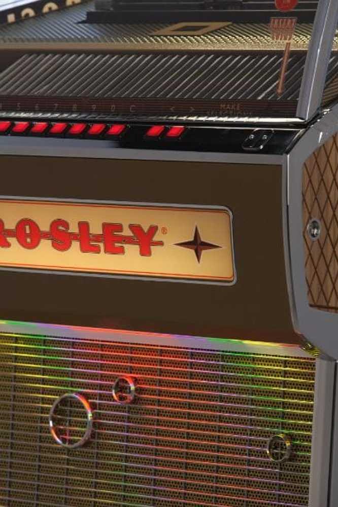 Crosley Rocket 80 CD Bluetooth Full-Size Jukebox - Black's decorative speaker grill, glowing with vibrant rainbow lights