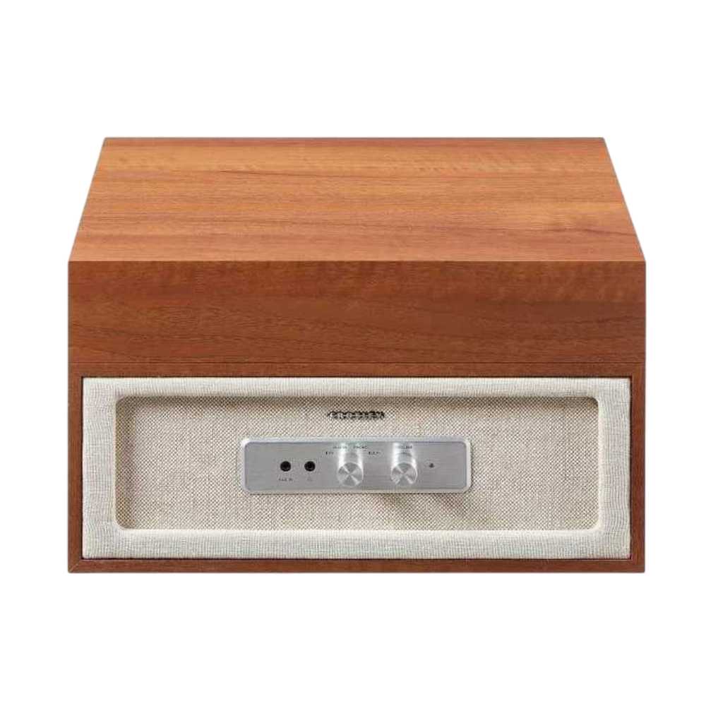 Crosley Rohe Turntable - Natural is shown with the lid closed, focusing on the front panel with control knobs and fabric speaker covering