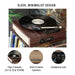 Crosley Scout Turntable - Walnut is a sleek, minimalist record player with a woodgrain finish, a vinyl disc on the platter, and built-in stereo speakers