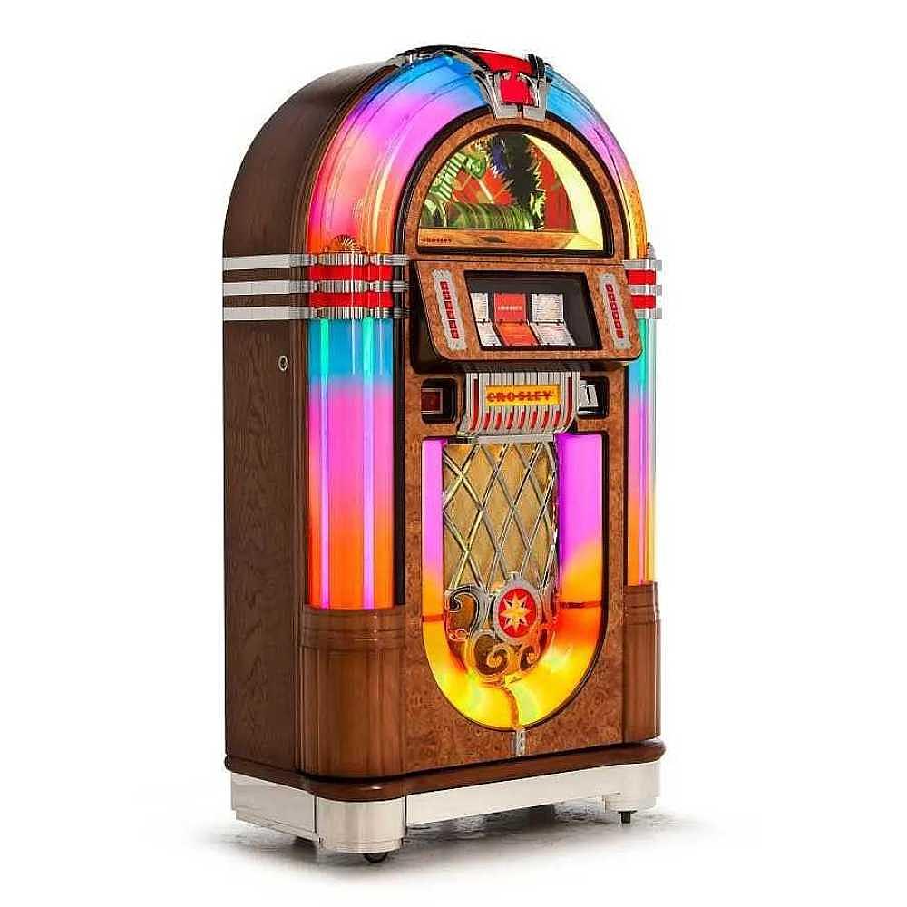 Crosley Slimline Bluetooth Full-Size Jukebox stands tall with a vibrant rainbow light display and a vintage wood finish