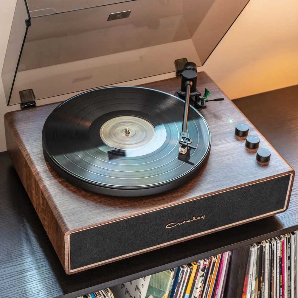 Crosley Stave Record Player - WalnutGold highlights its smooth walnut finish and simple controls