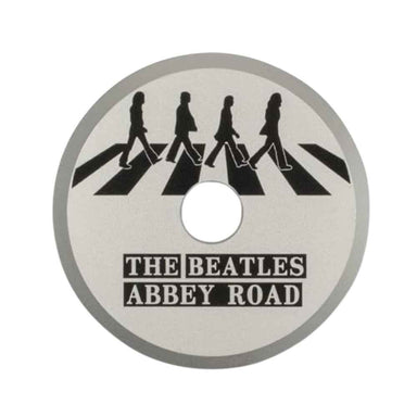 Crosley The BEATLES 45 Adapter - Abbey Road, featuring silhouettes of The Beatles crossing Abbey Road on a circular adapter