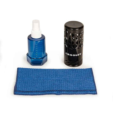 Crosley Vinyl Record Cleaning Set unboxed, featuring a black cleaning brush, a blue spray bottle, and a blue cleaning cloth