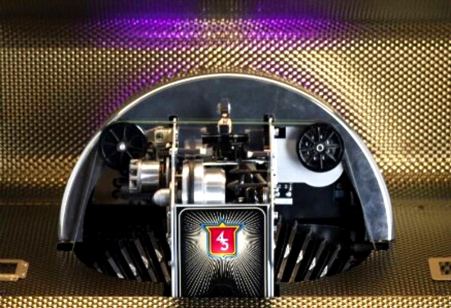 Crosley Vinyl Rocket Full-Size Jukebox - Black highlights its vinyl record mechanism, surrounded by elegant gold accents and bright lights