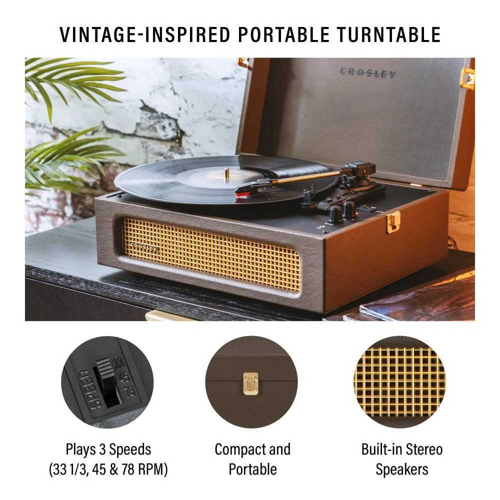 Crosley Voyager Portable Turntable with Bluetooth Out - Cocoa is shown open with a vinyl record playing