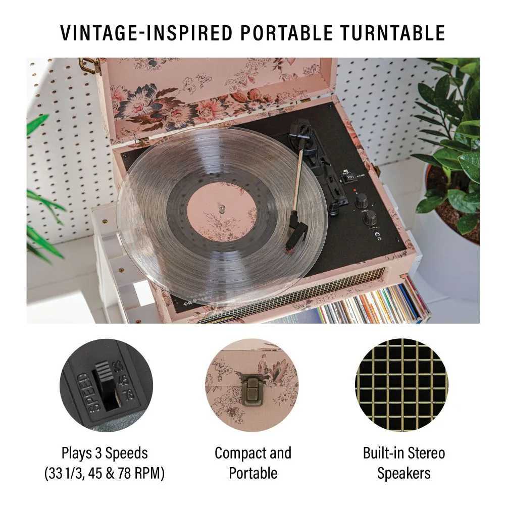 Crosley Voyager Portable Turntable with Bluetooth Out - Floral features a floral design, a transparent vinyl record on the platter, and a compact build