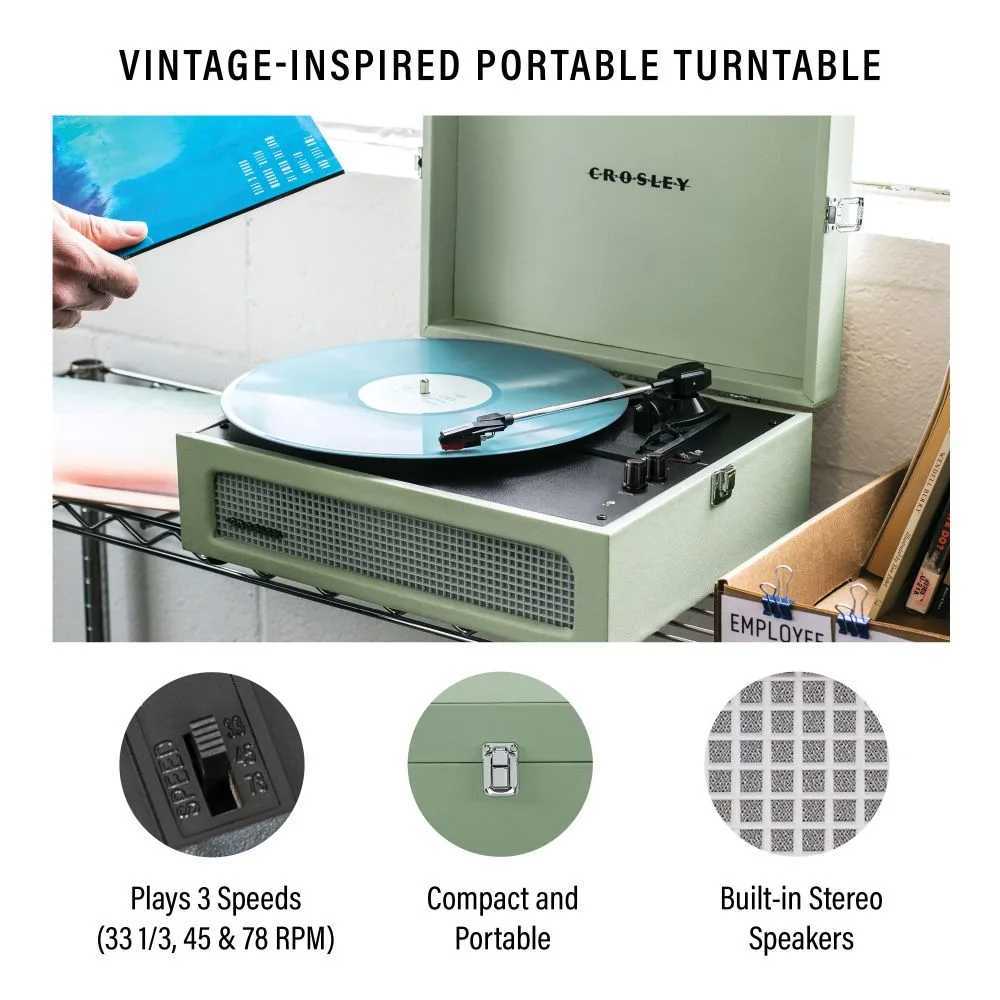 Crosley Voyager Portable Turntable with Bluetooth Out - Sage is shown playing a vinyl record, emphasizing its compact design and built-in stereo speakers