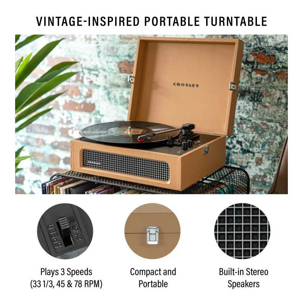 Crosley Voyager Portable Turntable with Bluetooth Out - Tan is shown playing a vinyl record, highlighting its vintage design, built-in stereo speakers, and compact portability