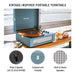 Crosley Voyager Portable Turntable with Bluetooth Out - Washed Blue is shown open, playing a vinyl record on a table