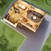A top-down view showing the furnished interior layout with a bedroom, living area, bathroom, and closet in the GardenHouse24 USA Den 70 Garden Room
