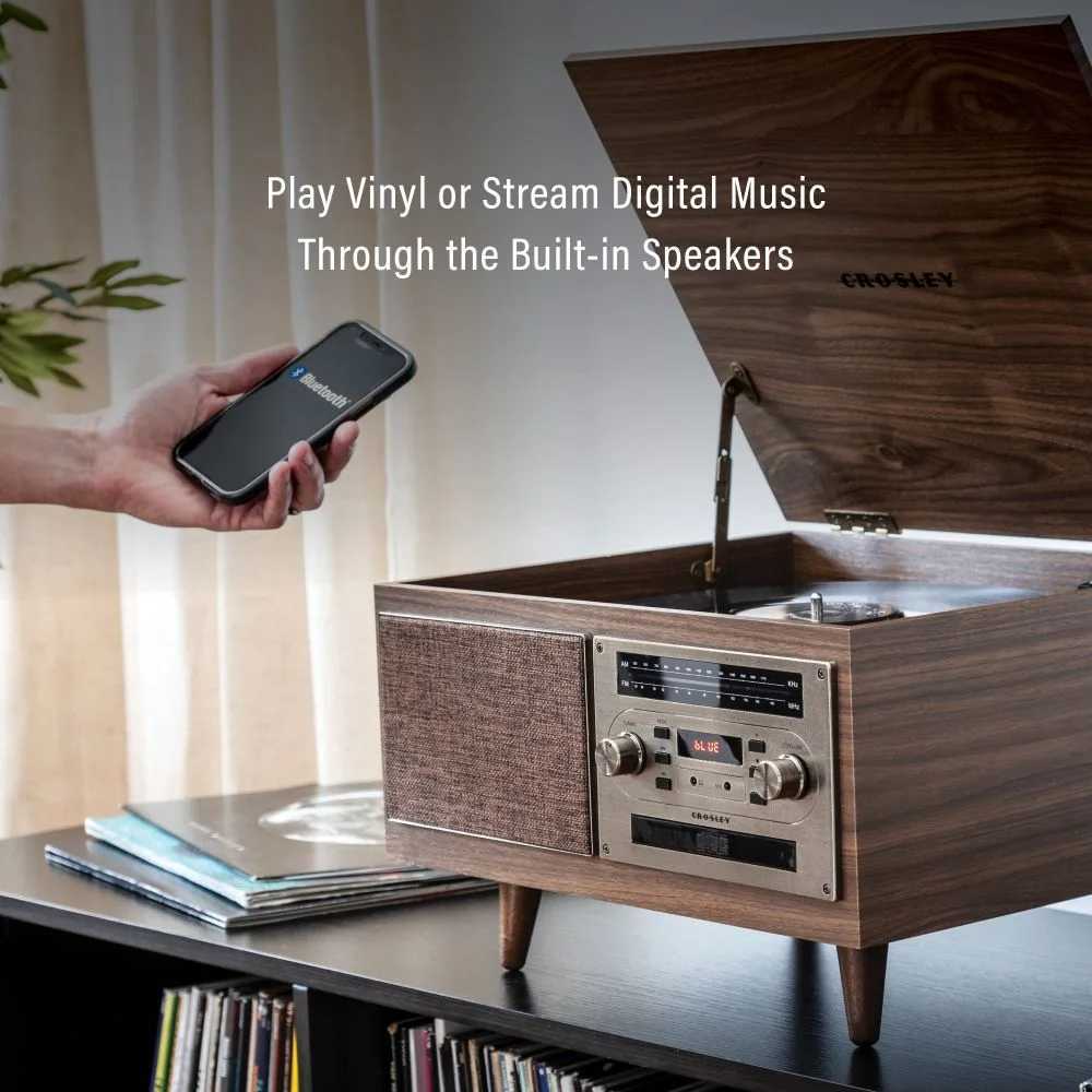 Designed for modern convenience, the Crosley Serenade 8-In-1 Record Player - Walnut plays vinyl and streams digital music via Bluetooth through its built-in speakers