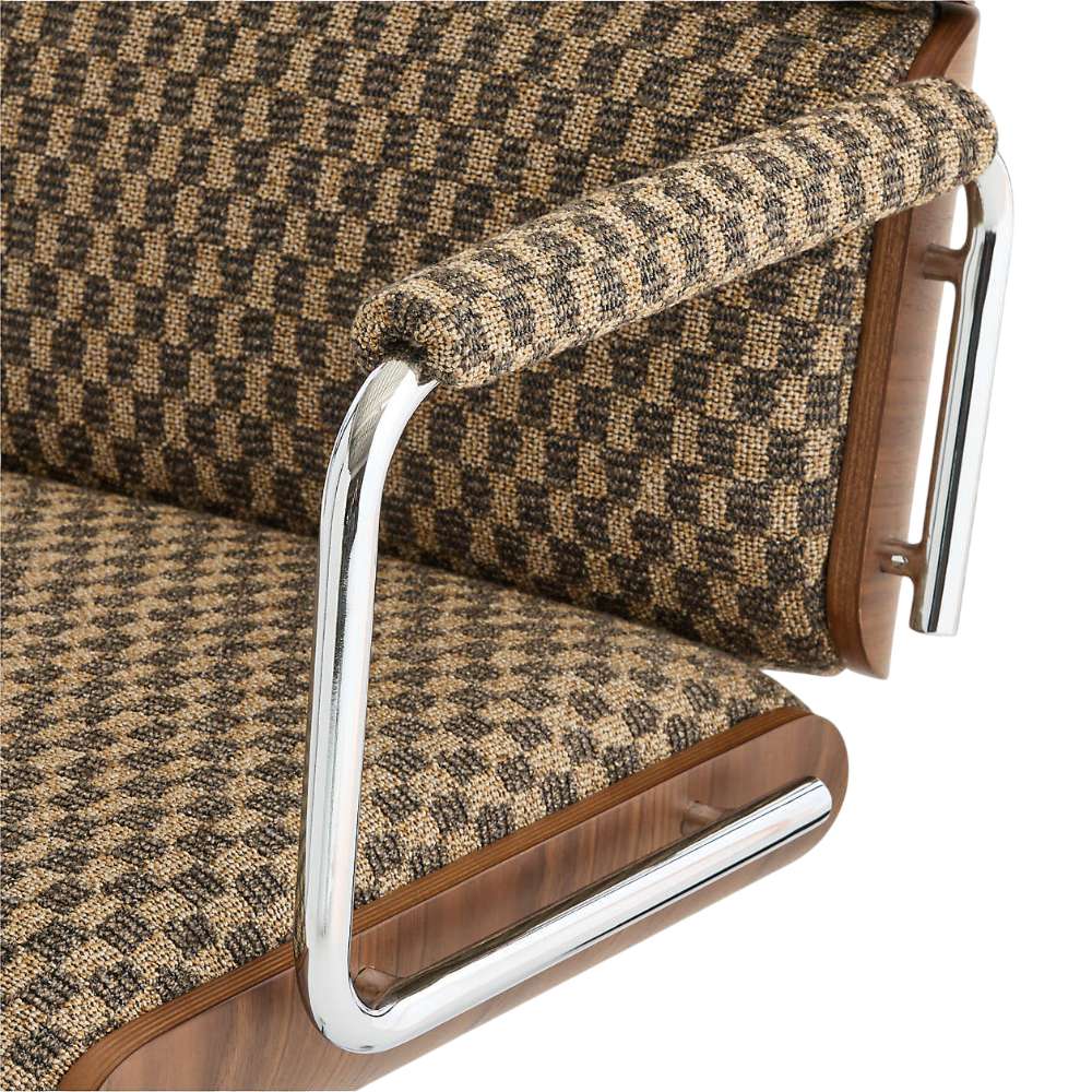 Detailed close-up of Crate & Barrel Palmer Upholstered and Wood Paneled Office Chair showing textured fabric, padded armrests, and polished chrome accents