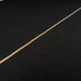 Detailed close-up of the brass hinge running across the black fabric-covered panels of GIK Acoustics ScreenPanel Vocal Screen