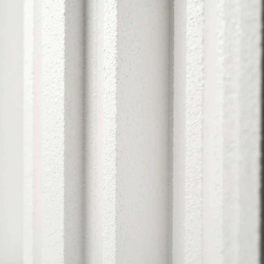 Detailed close-up of the vertical grooves and textured finish on a GIK Acoustics GridFusor™ Diffuser acoustic panel