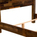 Detailed side view highlights the sturdy wooden frame and slatted support system of Fireside Lodge Barnwood Americana Bed