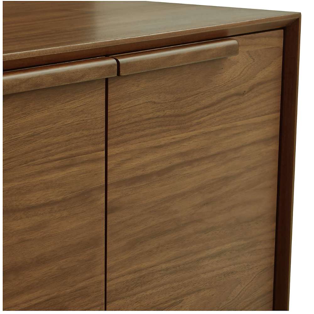 Detailed view of Crate & Barrel Tate 80" Walnut Storage Media Console showcasing its smooth walnut finish and cabinet hardware