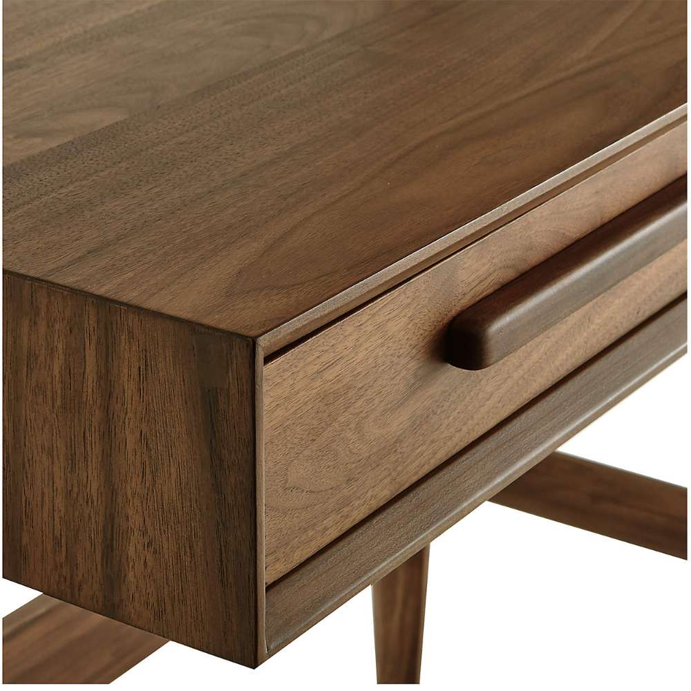 Detailed view of the walnut wood grain and drawer handle on the Crate & Barrel Tate Walnut Bookcase Desk with Outlet
