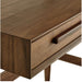 Detailed view of the walnut wood grain and drawer handle on the Crate & Barrel Tate Walnut Bookcase Desk with Outlet