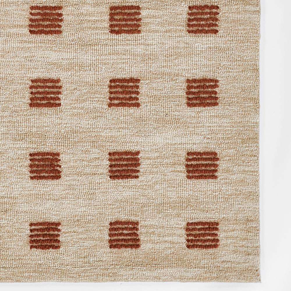 Detailed corner shot of Momeni Archer Indoor Rug - ARC-1 Rust showing the repeating square design
