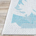 Detailed corner shot reveals the tight stitching of Couristan Monaco Indoor/Outdoor Rug - Coastal Flora/Ivory-Turquoise