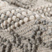 Detailed macro shot displays the woven loops and fibers of Momeni Andes Indoor Rug - AND-10 Ivory