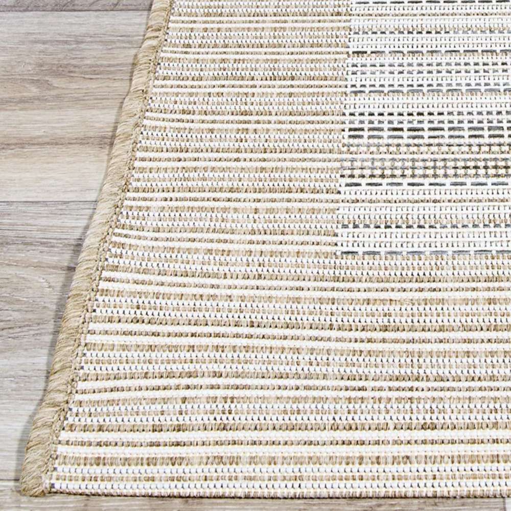 Detailed view of Couristan Monaco Indoor/Outdoor Rug - Bowline/Cocoa Natural-Ivory highlights its tightly woven border and clean finish