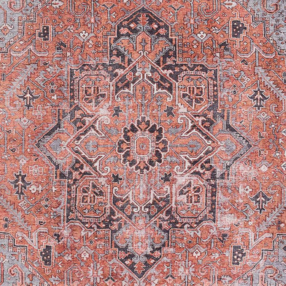 Detailed view of Momeni Afshar Indoor Rug - AFS36 Copper shows its central medallion with ornate floral and geometric patterns