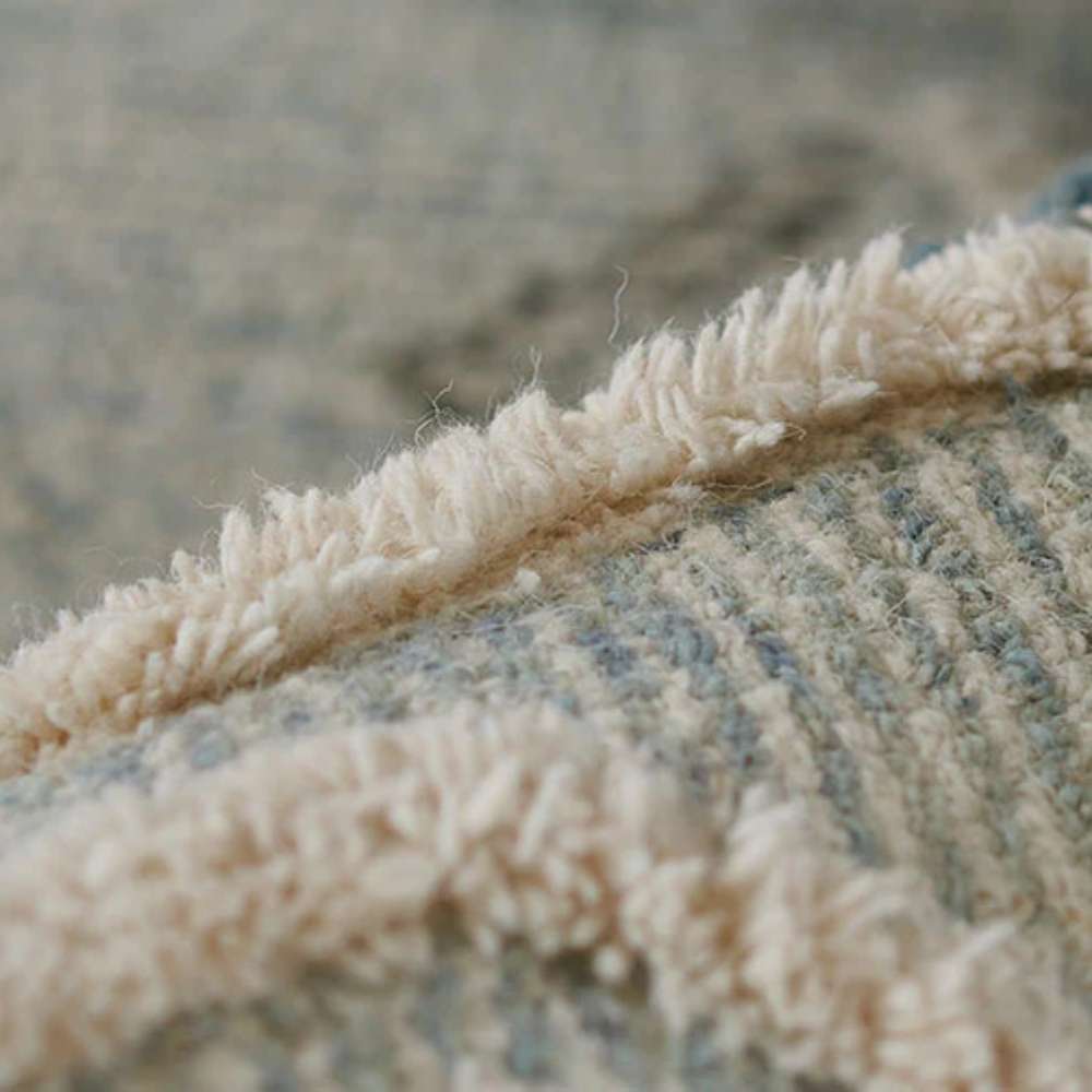 Detailed view of Momeni Allegro Indoor Rug - ALL-1 Blue reveals its plush tufted fibers