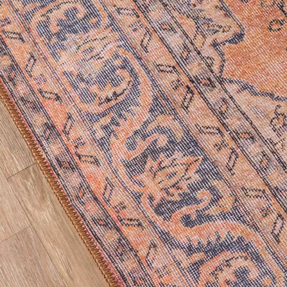 Detailed view of the intricate floral and vine motifs along the edge of Momeni Afshar Indoor Rug - AFS11 Copper