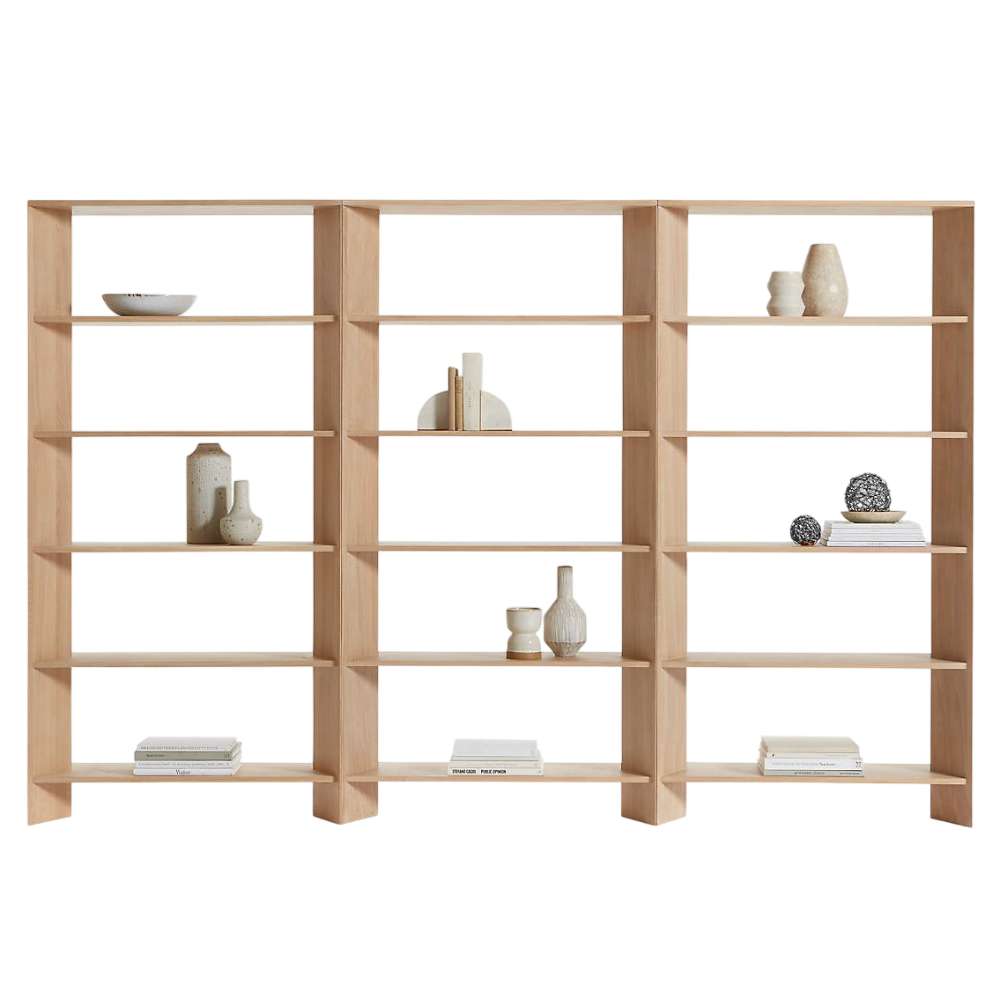 Displayed on a white background, Crate & Barrel Terrazza 114" Natural Solid Oak Wood 5-Shelf Bookcases, Set of 3 features three connected bookcases with fifteen open shelves for books and decor
