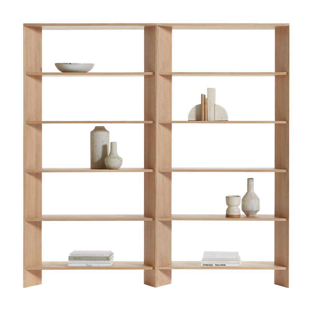 Displayed with decorative vases and books, Crate & Barrel Terrazza Natural Oak 5-Shelf Bookcases, Set of 2 showcases ten open shelves in a clean, symmetrical design