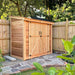 Double Door Cedar Roof Outdoor Living Today 8×4 SpaceSaver Lean-To Cedar Shed is neatly set against a wooden fence on a stone-paved area
