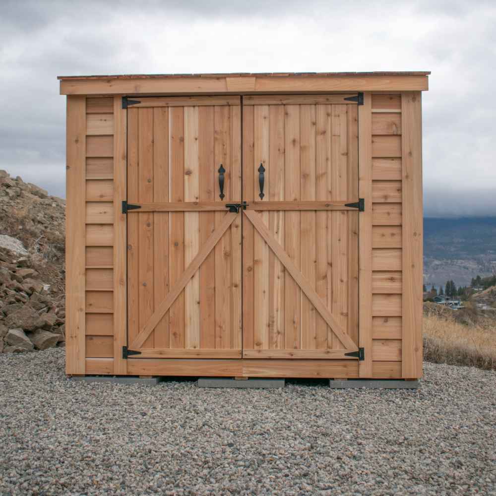Double Door Cedar Roof Outdoor Living Today 8×4 SpaceSaver Lean-To Cedar Shed stands with its sliding double doors closed