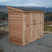 Double Door Metal Roof Outdoor Living Today 8×4 SpaceSaver Lean-To Cedar Shed is shown at an angle with its slanted metal roof and double sliding cedar doors