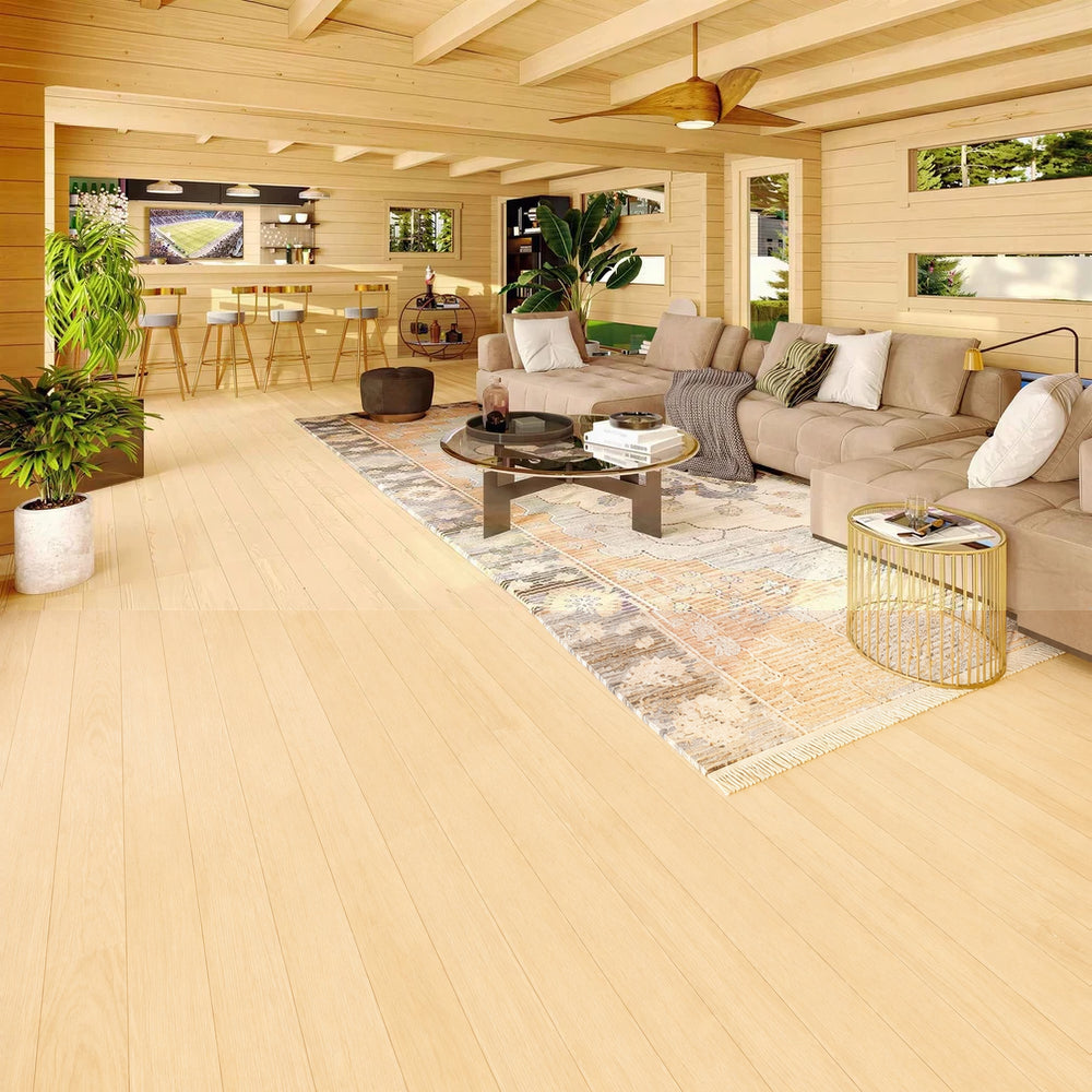 Inside the GardenHouse24 USA Dundee 90A Garden Room, there’s a cozy lounge with a large sectional sofa, bar counter, ceiling fan, and warm wood interior
