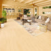 Inside the GardenHouse24 USA Dundee 90A Garden Room, there’s a cozy lounge with a large sectional sofa, bar counter, ceiling fan, and warm wood interior
