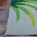 Edge of the Couristan Covington Indoor/Outdoor Rug - Flamingos/Multi lies neatly on stone flooring