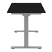 End view of Crate & Barrel Humanscale® eFloat Go 2.0 60" Black Adjustable Standing Charging Desk with a black top and silver T-shaped base