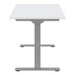End view of Crate & Barrel Humanscale® eFloat Go 2.0 60" White Adjustable Standing Charging Desk with a white top and silver T-shaped base