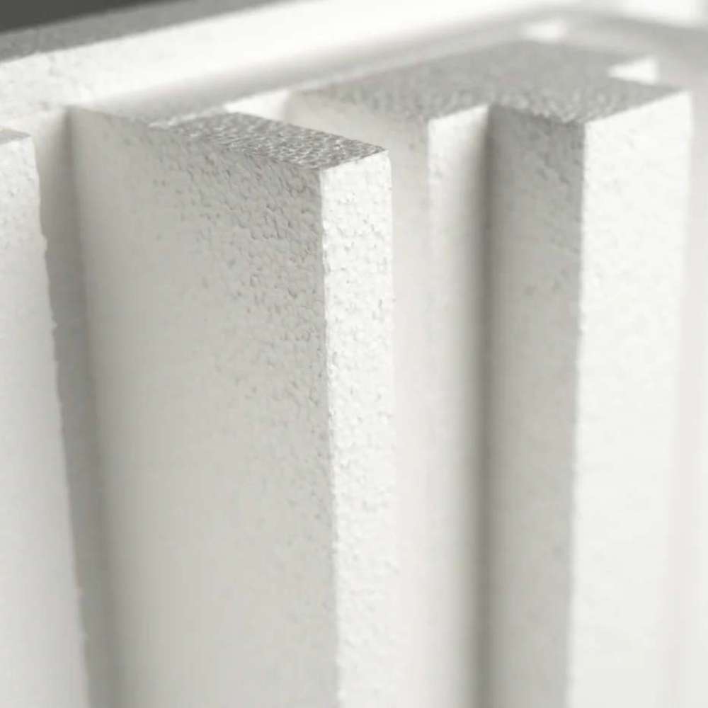 Extreme close-up of the thick raised fins on a white GIK Acoustics GridFusor™ Diffuser, highlighting its three-dimensional design