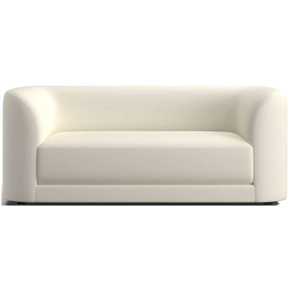 Fabric Creme (Covet Velvet) Crate & Barrel Contour Sofa featuring smooth creme velvet upholstery, rounded sides, and a spacious minimalist design