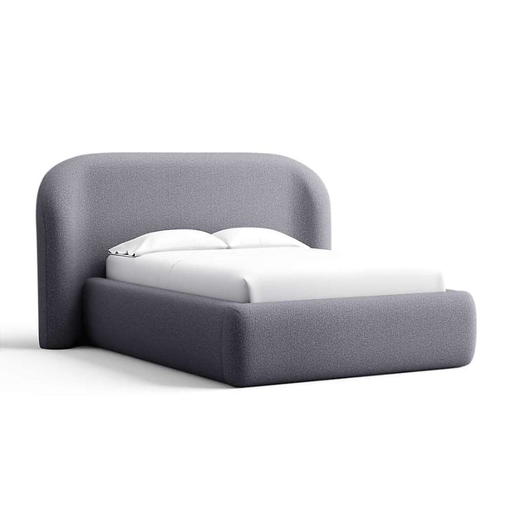 Fabric Ink (Icon Chenille) Crate & Barrel Adelaide Curved Upholstered Bed upholstered in deep ink blue chenille with a rounded headboard and soft upholstered frame