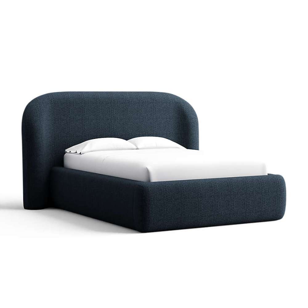 Fabric Midnight (Monet Recycled Chenille) Crate & Barrel Adelaide Curved Upholstered Bed upholstered in deep midnight blue chenille with a curved headboard and padded base