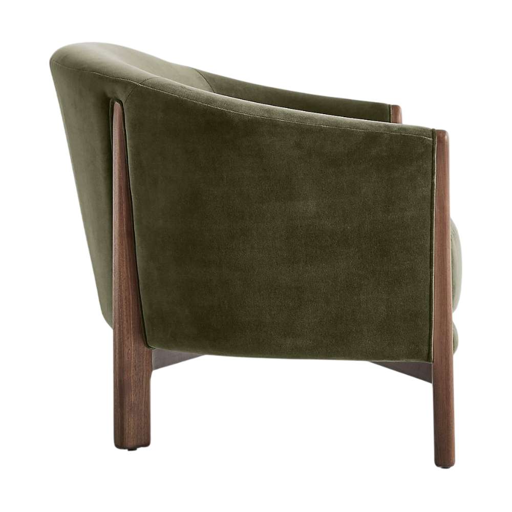 Fabric Olive (Como Velvet) Crate & Barrel Contour Sofa side view highlighting its curved olive velvet back and solid walnut wood frame