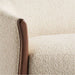 Fabric Tapioca (Lucie Boucle) Crate & Barrel Contour Sofa close-up showing the soft boucle fabric and curved walnut wood arm detail