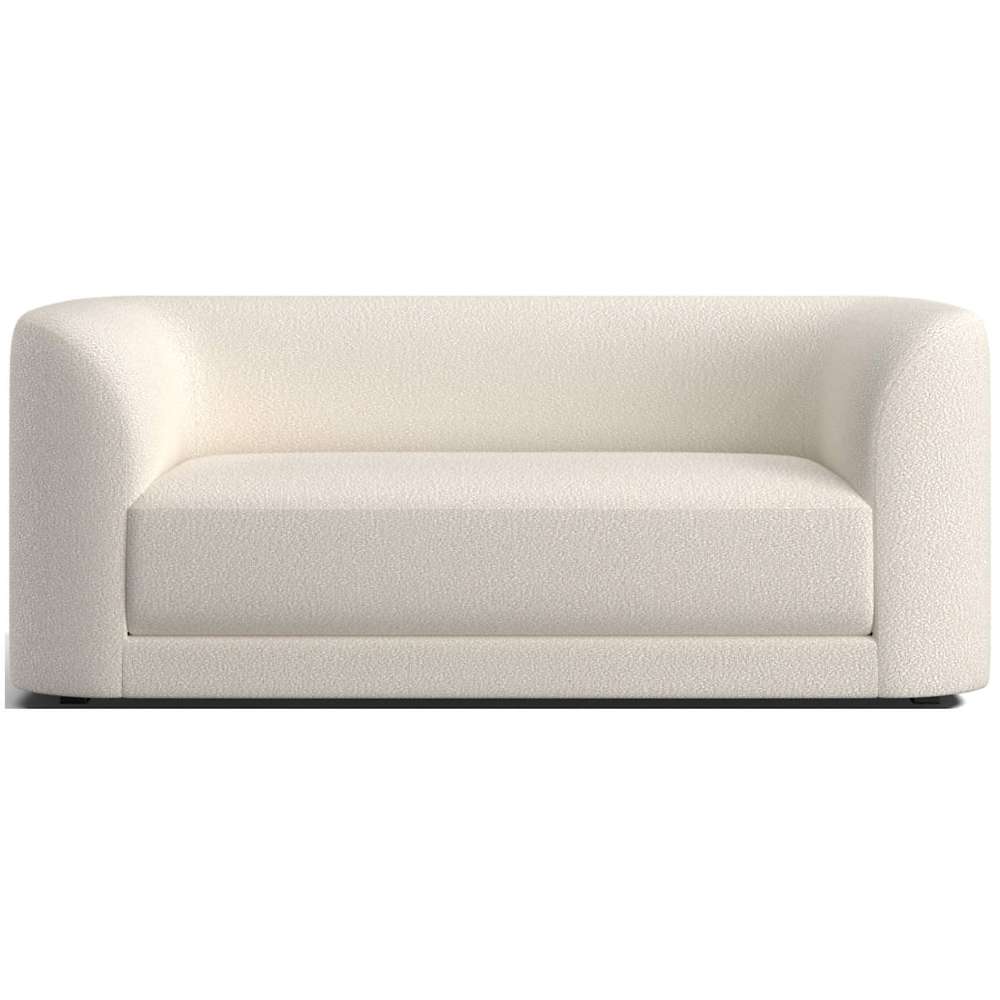 Fabric Tapioca (Lucie Boucle) Crate & Barrel Contour Sofa featuring creamy white boucle upholstery, rounded arms, and a deep cushioned seat with a modern look