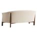Fabric Tapioca (Lucie Boucle) Crate & Barrel Contour Sofa shown from the back, highlighting its curved cream boucle upholstery and exposed walnut wood frame