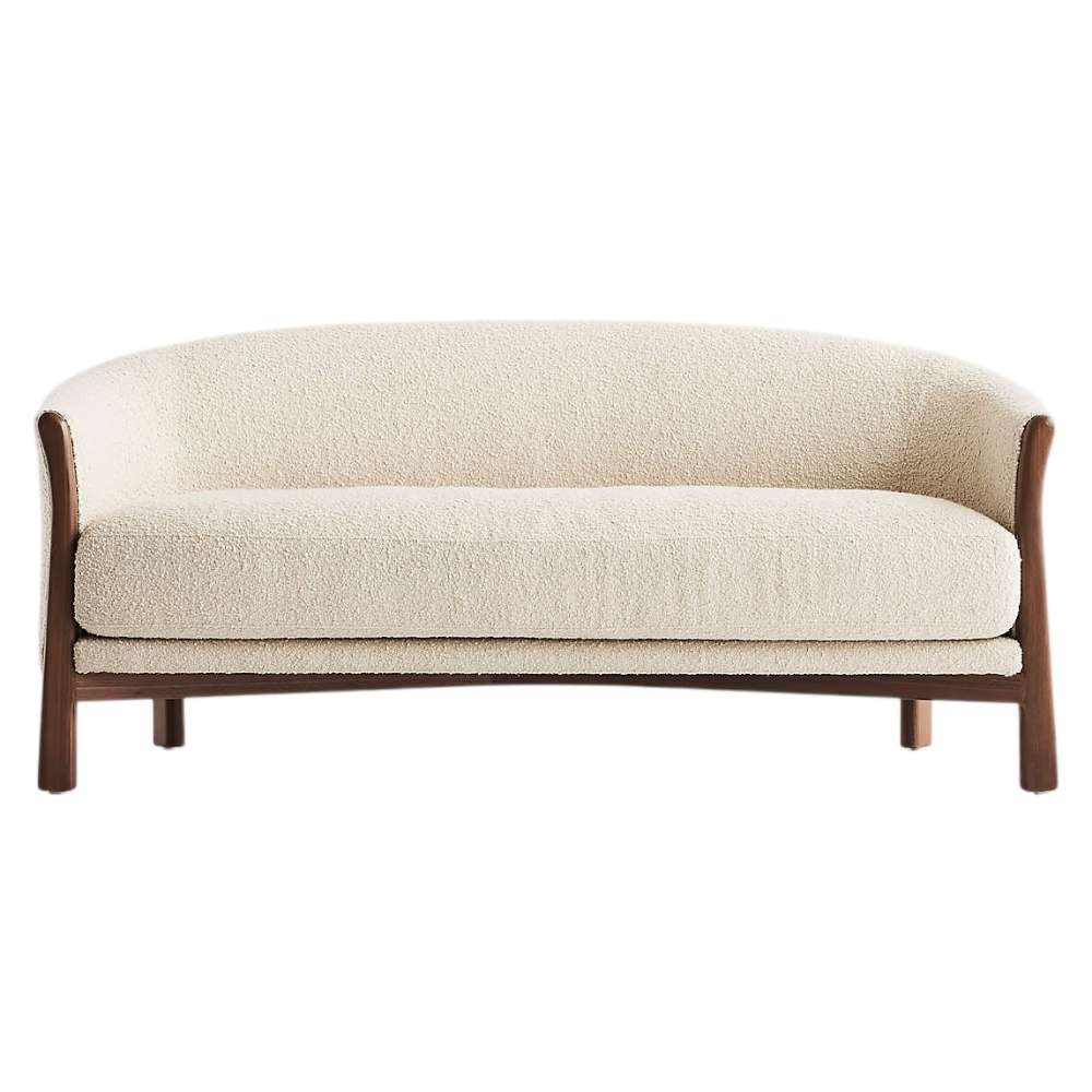 Fabric Tapioca (Lucie Boucle) Crate & Barrel Contour Sofa shown from the front with cream boucle upholstery, a curved back, and a walnut wood frame