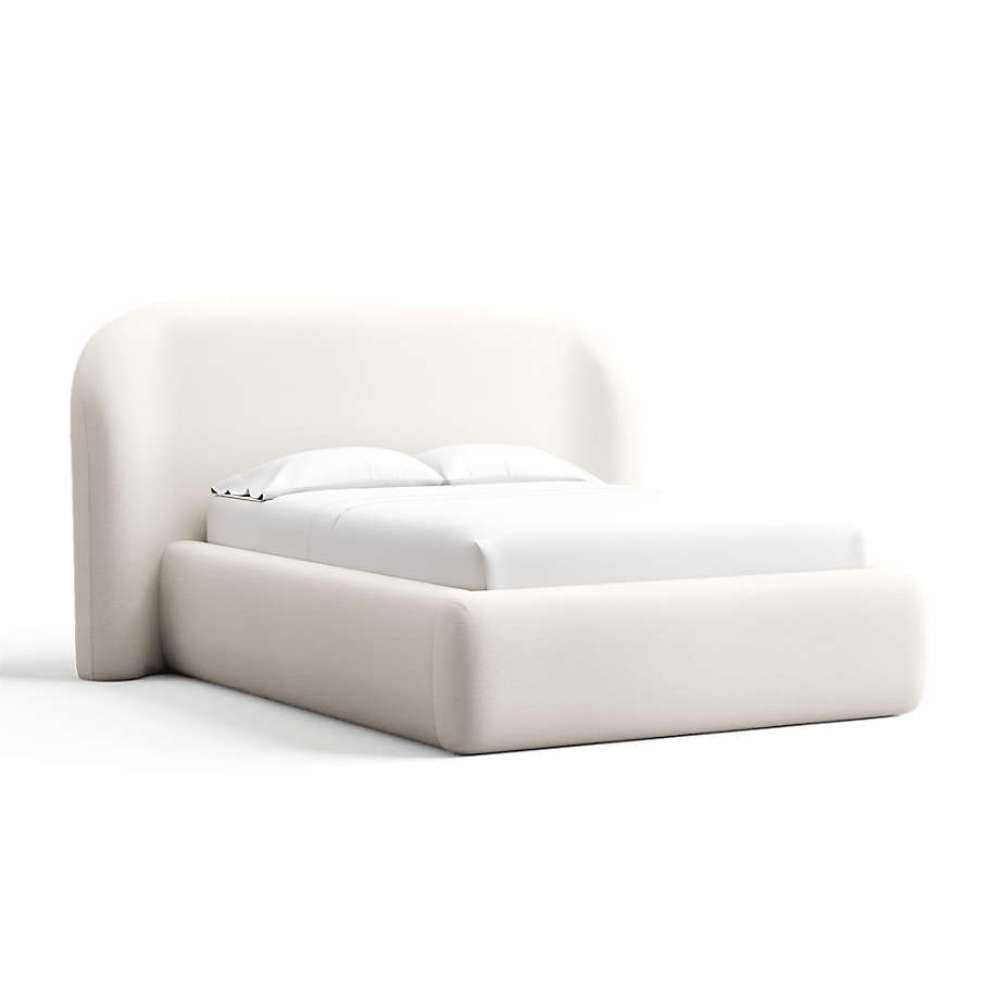 Fabric White (Linen Linen Weave) Crate & Barrel Adelaide Curved Upholstered Bed wrapped in crisp white linen upholstery with a curved headboard and soft upholstered frame